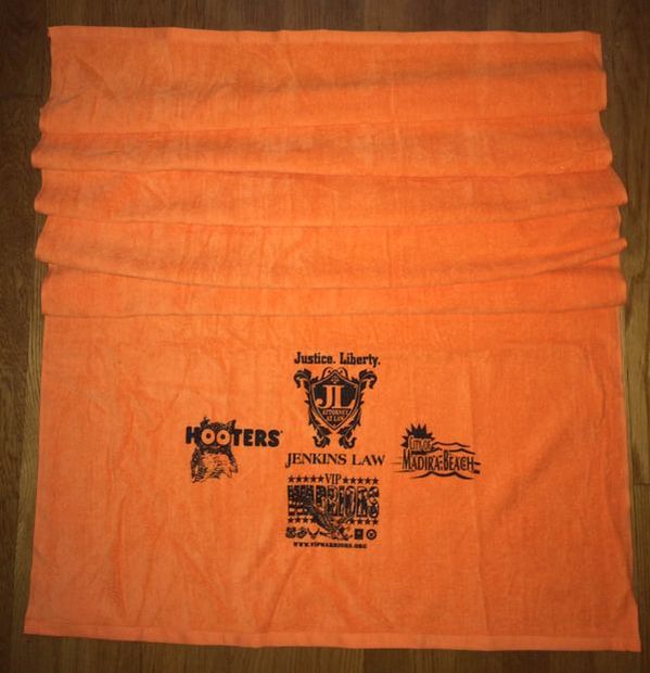 Orange beach towel for Madeira Beach 5K Sunset Race in Florida.
