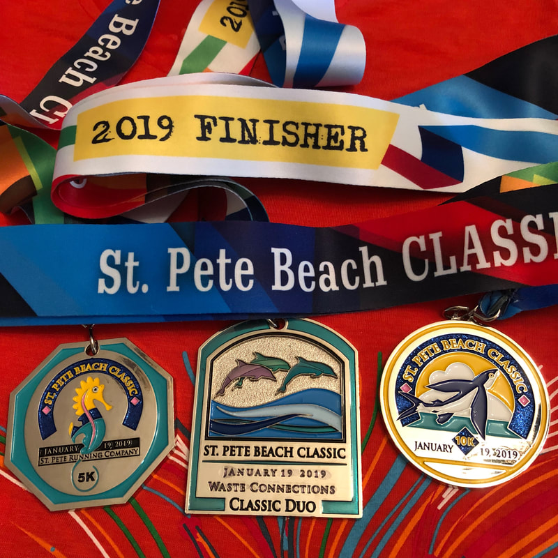 2019 medals from the St Pete Beach Classic 5K and 10K races.