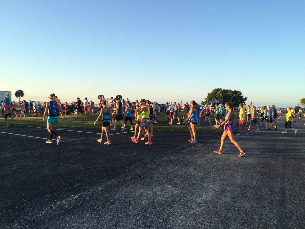 Runners walk across the parking lot at the 2015 Honeymoon Island Half Marathon.