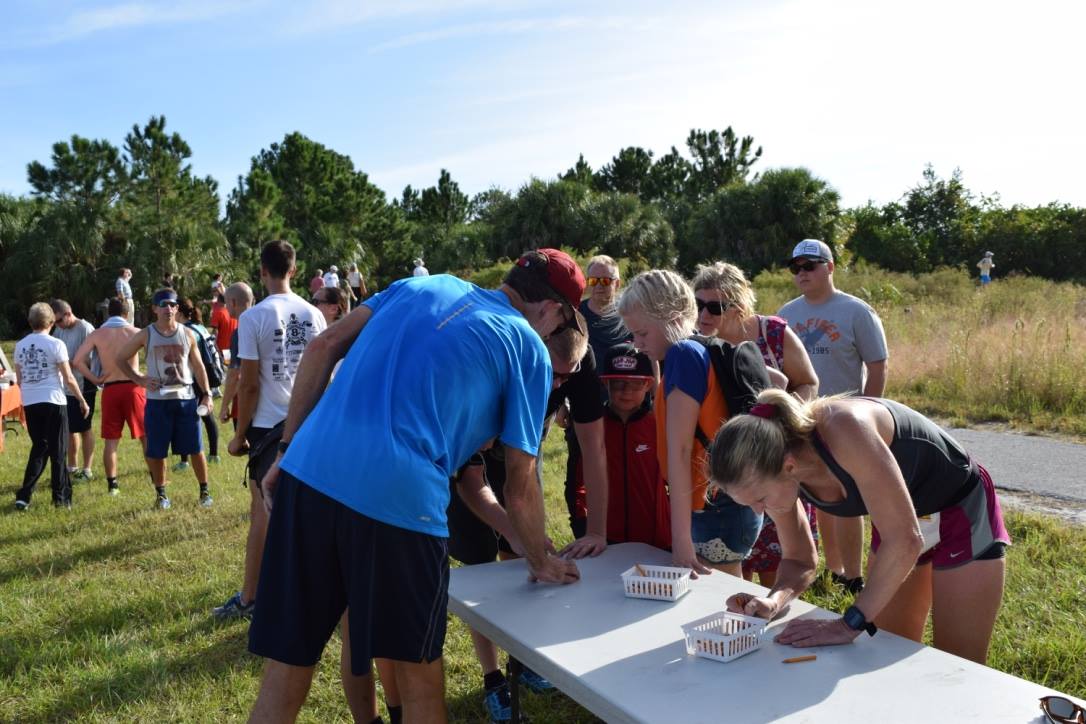 Runners record their times at the Weedon Trail Run